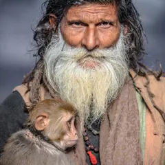 The unforgettable Monkey Baba of Varanasi, holding his companion. Their bond was legendary on the ghats, a story of friendship that I was privileged to document before they passed.