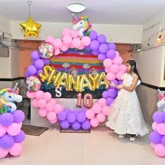 Another shot of the birthday girl enjoying her magical Unicorn party setup.
