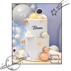 An out-of-this-world cake for a space-themed party. This two-tiered cake is adorned with planets, stars, and a little astronaut, perfectly capturing the theme for Viaan's birthday.