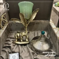 My Majestic Diwali Hamper, featuring a brass elephant decor piece and a hammered metal jar, presented in a luxurious velvet-lined box. This is the perfect executive gift to convey hope and aspiration during the festive season.