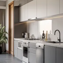 This kitchen showcases a sophisticated two-tone design with dark grey lower cabinets and white uppers. The straight-line layout is perfect for smaller spaces, offering a sleek and efficient cooking area.