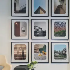 A look at the gallery wall in our studio. This collection of framed images from our projects serves as a constant source of inspiration and a reminder of the diverse spaces we have had the pleasure of creating.