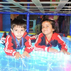 Two students enjoying the light-up sensory floor. Our play areas offer unique experiences that combine physical activity with sensory stimulation.