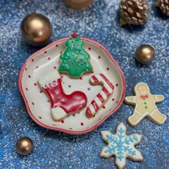 A simple, beautiful shot of our assorted Christmas cookies. This plate features a Christmas tree, stocking, candy cane, and snowflake, all hand-decorated with colorful icing. They look and taste like Christmas.