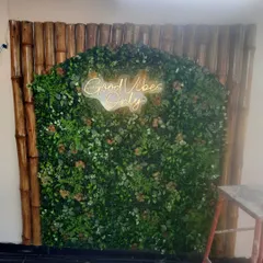 A great feature wall can make a space unforgettable. For this terrace, we created a lush green wall with a custom "Good Vibes Only" neon sign, framed by natural bamboo. It's the perfect photo corner and adds so much personality.