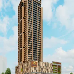 A full view of the Inspira Realty tower in Borivali, showcasing its slender profile against the sky. This mixed-use building combines luxury residences with expansive decks, high-end retail at the podium level, and integrated parking, all within a single, elegant structure.