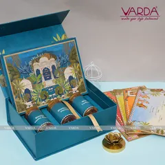 For a touch of artistic elegance, I designed this peacock-themed invitation box in a striking shade of blue. It includes gourmet jars and a suite of matching invitation cards, perfect for a sophisticated and vibrant wedding celebration.