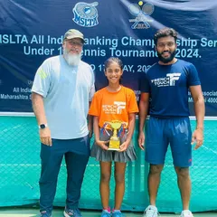 A champion with her support system. Eshal stands with her coaches after her remarkable victory at the MSLTA U14 AITA event. This moment reflects the collaborative effort and commitment of our entire team.