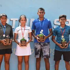 The winners and runners-up of the AITA CS 3 U18 tournament proudly display their medals and eco-friendly potted plant awards. We celebrate every achievement and encourage sustainability in sports.