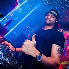 In the zone at Kandy Shop club, giving the crowd a thumbs up. I'm focused on reading the room and playing the right track at the right time, ensuring the energy stays high all night with a mix of Bollywood and R&B.