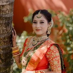 A beautiful South Indian bride wearing one of my temple jewellery sets. The choker, long necklace, and jhumkas perfectly match her traditional silk saree.