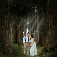 A quiet, shared glance between two people, framed by the immense scale of the ancient forest. This composition emphasizes their connection, making them the center of their own enchanting world.