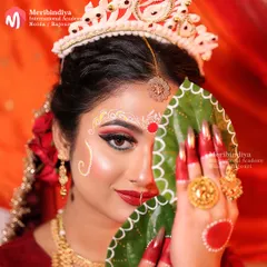 This iconic pose with the betel leaves (paan) is a key part of the Bengali wedding ritual. You'll learn to create makeup that looks stunning in these traditional moments.