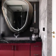 Another angle of the master bathroom, showcasing the custom vanity with its flushed sink and unique hardware. Every detail is crafted to create a cohesive and stylish design that flows with the master bedroom's bold concept.