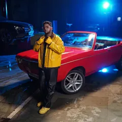On the set of the "Backseat" music video. We got this vintage red convertible to capture that perfect G-Funk and melodic rap feel.