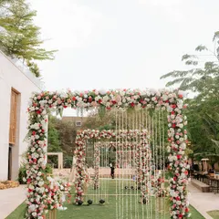 Imagine walking towards your forever through a dreamy pathway of floral arches. We design immersive entrances like this one to make your journey to the mandap feel truly spectacular.