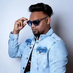 This look, with the denim jacket and sunglasses, is part of my brand. It's about projecting confidence and a cool, modern vibe that resonates with my music.