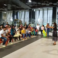 Here I am, performing for a wonderful audience of children and adults at Opus Consulting Services. My workshops are a great fit for corporate family days and events, bringing everyone together for a shared experience of wonder and fun.