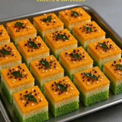 A full tray of our Tiranga Dhokla, ready to be served at a national holiday celebration or a themed event.