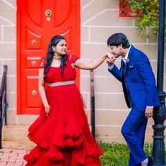 This royal blue suit is a stylish rental choice for a pre-wedding shoot, creating a vibrant and coordinated look with our red gown.
