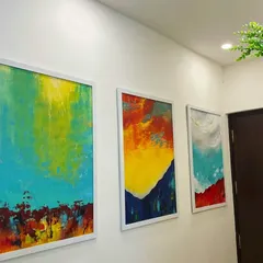 This triptych of modern abstract paintings shows my love for bold colors and textures. Created with acrylics on large canvases, these pieces were commissioned to be the vibrant focal point of a hallway, adding energy and personality to the home's decor.