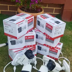 A set of Hikvision 4MP IP bullet cameras ready for an outdoor installation. These are weatherproof and provide high-resolution video.