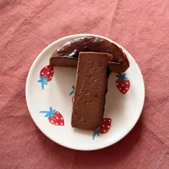 A slice of my rich and decadent chocolate Basque cheesecake. This cheesecake has a beautifully caramelized "burnt" top and a creamy, almost fudgy interior, offering a unique texture and deep chocolate flavor.
