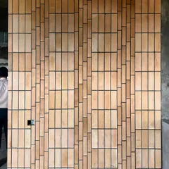 A work-in-progress detail of a brick facade. We explored various pixelated patterns to create a textured, visually engaging surface, showcasing our hands-on approach to material experimentation and craftsmanship on site.