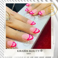 A fun, graphic take on the French manicure. I used a bright, hot pink polish to create an abstract tip design on a sheer pink base.