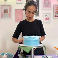 Concentrating on getting the buttercream smooth. Every cake is a canvas, and I take my time to make sure it's just right.