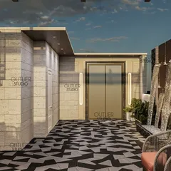 This view of the party terrace shows the lift entrance and a spiral staircase, with a dramatic water feature and bold geometric flooring that makes a strong design statement.