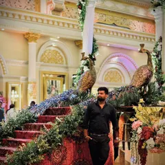 Taking a moment at a beautifully decorated venue. My passion is capturing the grandeur of these events from a perspective that no one else can.