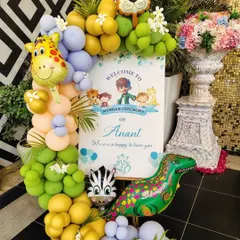 The welcome sign is the first thing guests see. For Anant's jungle-themed Mundan, I designed this personalized sign and framed it with a colorful balloon arrangement and animal foil balloons to set a fun and inviting tone right from the entrance.