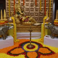 A front view of the detailed floral rangoli created for the corporate event. The intricate pattern and vibrant colors create an impressive and welcoming sight for attendees.
