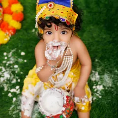 Getting messy with the makhan! This little Krishna is having the time of his life during our fun Janmashtami shoot.