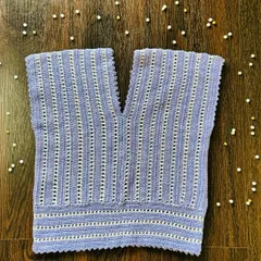 My new lavender and cream V-neck top. The vertical stitch pattern is designed to be flattering, and the scalloped edges add a soft, finished detail to the hem and neckline.
