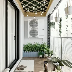 We cleverly concealed an outdoor AC unit with custom planters while adding a beautiful ceiling trellis with string lights. This design maximizes green space with hanging plants and a tidy planter box, creating a functional and beautiful urban garden.