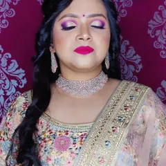 A close up of the vibrant eye makeup for this engagement look. The blend of purple and pink eyeshadow creates a dramatic and celebratory feel.