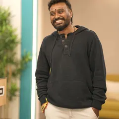 A relaxed and smiling pose. My goal is to create a space where everyone feels comfortable, happy, and free to be themselves.