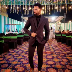 Every day is a runway. A stylish look with a suit and turtleneck for a wedding reception.