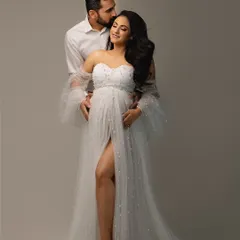The gentle embrace of a partner brings such warmth and tenderness to a maternity portrait. This is a memory of strength, support, and shared excitement.