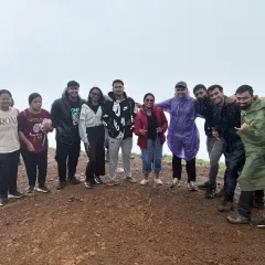 The group posing for another fun photo at the top, enjoying the moment.