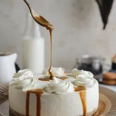 A beautiful caramel cheesecake, shot for a dessert company. The monochromatic beige tones and the dripping caramel create a sophisticated and elegant look.