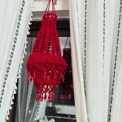 My handmade crochet Aakash Kandil in a vibrant red, adorned with crystal-like beads that catch the light beautifully. A perfect decoration for Diwali.