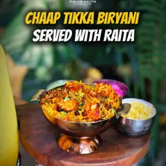 A unique twist on a classic, our Chaap Tikka Biryani is served with cool raita. The smoky flavour of the chaap tikka pairs perfectly with the fragrant rice.