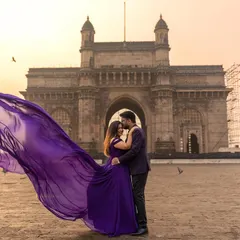 A magical moment captured at the Gateway of India. My purple flying gown with its magnificent trail adds a touch of royal elegance, perfect for creating iconic pre-wedding photos.