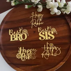 Small toppers, big love. Our collection of gold acrylic Rakhi charms includes "Best Bro," "Best Sis," and "Happy Rakhi" designs to adorn your festive treats.