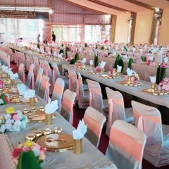 We specialize in grand, traditional seated dining. This extensive setup with golden thalis is from a beautiful Jain wedding, where we served hundreds of guests with care and precision.