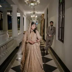 An artistic shot in a classic checkered hallway, with the bride in the foreground, creating a sense of depth and story.