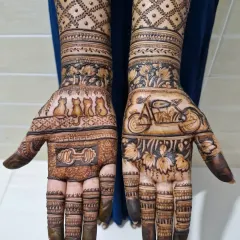 A close-up of the unique, personalized motifs on the palms: four cats, a dumbbell, and a motorcycle.